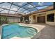 Stunning screened pool with a built-in outdoor kitchen and spacious patio area at 9852 Caroline Park Dr, Orlando, FL 32832