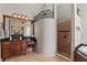 Well lit bathroom features a walk-in shower, a vanity with dark counters, and a decorative partition wall at 1070 Henley Downs Pl, Lake Mary, FL 32746