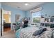 Comfortable bedroom featuring a ceiling fan, desk, workspace, and shelves at 1070 Henley Downs Pl, Lake Mary, FL 32746