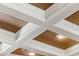 Detailed coffered ceiling with recessed lighting adds architectural interest and sophistication to the home at 1070 Henley Downs Pl, Lake Mary, FL 32746
