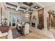 Spacious dining room with a stone fireplace and access to the outdoors, ideal for gatherings and relaxation at 1070 Henley Downs Pl, Lake Mary, FL 32746
