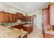 Spacious kitchen showcasing granite countertops, stainless steel appliances, and wood cabinetry at 1070 Henley Downs Pl, Lake Mary, FL 32746