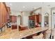 Open kitchen featuring a breakfast bar, stainless steel appliances, and a center island at 1070 Henley Downs Pl, Lake Mary, FL 32746