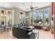 Bright and airy living room featuring large windows with a view, a comfortable seating area, and stylish decor at 1070 Henley Downs Pl, Lake Mary, FL 32746