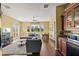 Inviting living room with hardwood floors, a large sofa, and a nearby dining area at 1070 Henley Downs Pl, Lake Mary, FL 32746