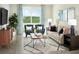 Cozy living room with comfortable seating, a modern rug, and a large window with scenic views at 1114 Cumberland Trail Dr, Lake Hamilton, FL 33851