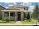 Charming two-story home with covered porch, manicured lawn, and beautiful landscaping at 11176 Hollow Bay Dr, Winter Garden, FL 34787