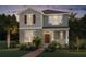 Charming two-story home with a combination of siding and shingles and a well-manicured lawn and landscaping at 11182 Hollow Bay Dr, Winter Garden, FL 34787
