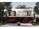 Modern townhouse with a two-car garage and a sleek design with a white and brown color scheme at 11302 Westwood Blvd # 28, Orlando, FL 32821