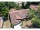 Aerial view of a charming home with a well-maintained roof, attached garage, and landscaped front yard at 1241 Leatherwood Dr, Altamonte Springs, FL 32714