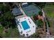 An overhead shot of tennis courts, a pool, a clubhouse, and a playground at 1241 Leatherwood Dr, Altamonte Springs, FL 32714