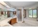 Bathroom with double sink, skylight, tiled floors, glass shower, and soaking tub at 1241 Leatherwood Dr, Altamonte Springs, FL 32714