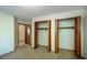 Bright bedroom featuring carpet and a closet with wood doors at 1241 Leatherwood Dr, Altamonte Springs, FL 32714