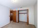 Bedroom featuring carpet and a closet with wood doors at 1241 Leatherwood Dr, Altamonte Springs, FL 32714