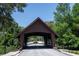 Community covered bridge provides a charming entrance at 1241 Leatherwood Dr, Altamonte Springs, FL 32714