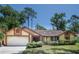 Charming single-story home with well-maintained landscaping and a two-car garage at 1241 Leatherwood Dr, Altamonte Springs, FL 32714