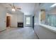 Bright living area with tiled floor, fireplace, adjacent kitchen, and screened porch access at 1241 Leatherwood Dr, Altamonte Springs, FL 32714