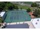 Aerial view of community tennis courts, fenced, lighted, with shade structures at 1241 Leatherwood Dr, Altamonte Springs, FL 32714