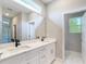 Modern bathroom featuring double vanity sinks, sleek countertops, and ample storage space at 12885 Sw 43, Ocala, FL 34473