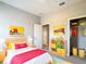 Cheerful bedroom featuring colorful decor, playful artwork, and ample storage for toys and clothes at 12885 Sw 43, Ocala, FL 34473