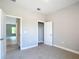 Bright bedroom highlighting an open doorway into the rest of the house at 12885 Sw 43, Ocala, FL 34473