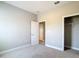 Neutral bedroom with plush carpeting, light gray walls, and closet for storage at 12885 Sw 43, Ocala, FL 34473