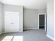 Bedroom with plush carpeting, neutral walls, double door closet, and access to another room at 12885 Sw 43, Ocala, FL 34473