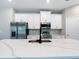 Modern kitchen featuring white cabinets, stainless steel appliances, and quartz countertops at 12885 Sw 43, Ocala, FL 34473