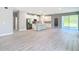 Open-concept kitchen with stainless steel appliances, a center island, and sleek, modern design at 12885 Sw 43, Ocala, FL 34473