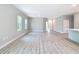 Expansive living area featuring durable flooring and a seamless connection to the kitchen area at 12885 Sw 43, Ocala, FL 34473