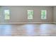 Sunlit living room highlighting beautiful flooring and neutral wall colors, creating a serene space at 12885 Sw 43, Ocala, FL 34473