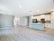 Open floor plan showcasing modern kitchen and spacious living area for entertaining or Gathering time at 12885 Sw 43, Ocala, FL 34473