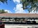 Resident carport area on a sunny day with ample spots for covered parking at 14001 Fairway Island Dr # 525, Orlando, FL 32837