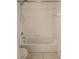 Clean white bathtub with a shower head and tiled walls in the bathroom at 14001 Fairway Island Dr # 525, Orlando, FL 32837