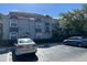 Exterior view of the building with clean curb appeal and ample parking spots at 14001 Fairway Island Dr # 525, Orlando, FL 32837
