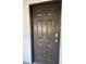 A close-up of the unit door with a door knocker and a digital door lock at 14001 Fairway Island Dr # 525, Orlando, FL 32837