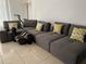 Comfortable living room featuring a sectional couch with stylish throw pillows at 14001 Fairway Island Dr # 525, Orlando, FL 32837