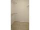 Walk-in closet with tile flooring and white wire shelving units at 14001 Fairway Island Dr # 525, Orlando, FL 32837