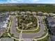 Aerial view of the community with well-maintained landscaping and mature trees in a central park area at 14826 Deaton Aly, Orlando, FL 32827