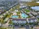Aerial view showcasing the community's pools, amenities, neighborhood, and convenient proximity to retail and recreation at 14826 Deaton Aly, Orlando, FL 32827