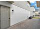 The side of the home features brick flooring and a painted brick wall at 14826 Deaton Aly, Orlando, FL 32827