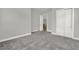 Carpeted bedroom featuring an open closet and entry to the hall at 14826 Deaton Aly, Orlando, FL 32827