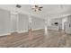 Spacious living area showcases wood-look floors, recessed lighting, and open access to a modern kitchen at 14826 Deaton Aly, Orlando, FL 32827
