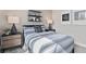 Tastefully decorated bedroom with bedside lamps and artwork at 1524 Groveline Rd, St Cloud, FL 34771