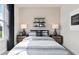 Tastefully decorated bedroom with bedside lamps and artwork at 1524 Groveline Rd, St Cloud, FL 34771