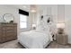 Bright and inviting bedroom with stylish lighting, furniture, and decor at 1524 Groveline Rd, St Cloud, FL 34771