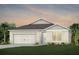 Charming single-Gathering home with a two-car garage and manicured lawn at 1524 Groveline Rd, St Cloud, FL 34771
