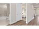 Hallway with doorways to the bathroom and bedroom at 1524 Groveline Rd, St Cloud, FL 34771