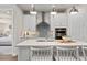 Bright, open kitchen with pendant lighting and access to the bedroom at 1524 Groveline Rd, St Cloud, FL 34771
