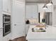 Modern kitchen with stainless steel appliances, quartz countertops, and built in ovens at 1524 Groveline Rd, St Cloud, FL 34771